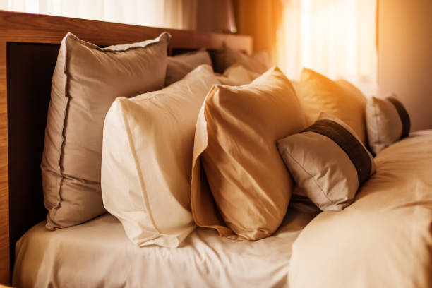 istock light soft pillow on beautiful bed cozy bedroom with sun light from window interior concept 936496536