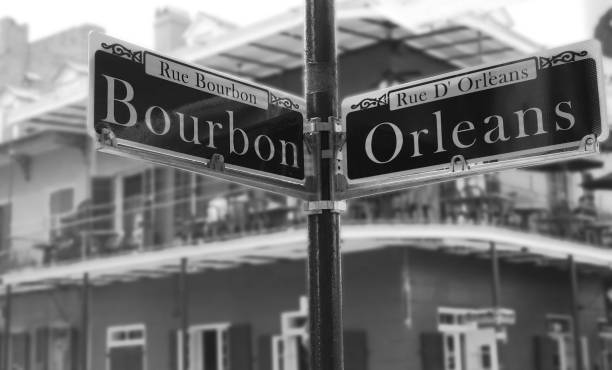 Corner of Bourbon Street Bourbon Street sign at the corner of Orleans, in the French Quarter french quarter stock pictures, royalty-free photos & images