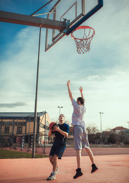 istock Two basketball players playing basketball 936496802