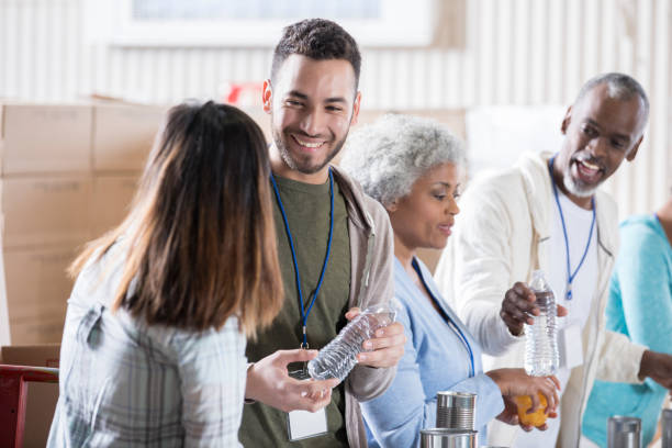 istock Couple volunteering together during food drive 936497162