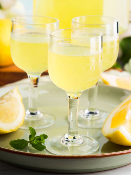 istock Home made limoncello in stemmed glasses 936500016