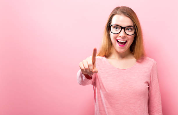 istock Young woman pointing at something 936504724