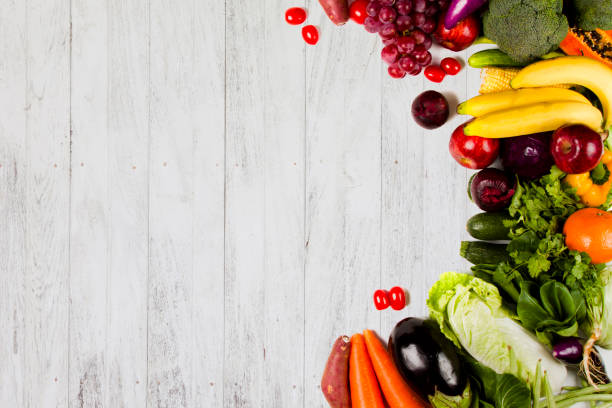 istock Fruits and Vegetable on white wood background 936505574