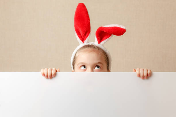 istock Bunny little girl with blank banner. Place for text or theme. 936505632
