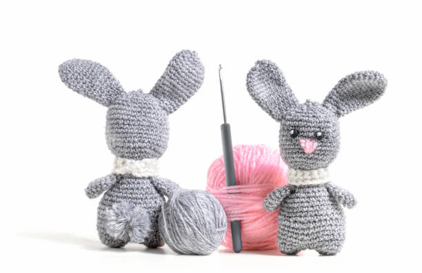 Knitted hare amigurumi with tangles of thread