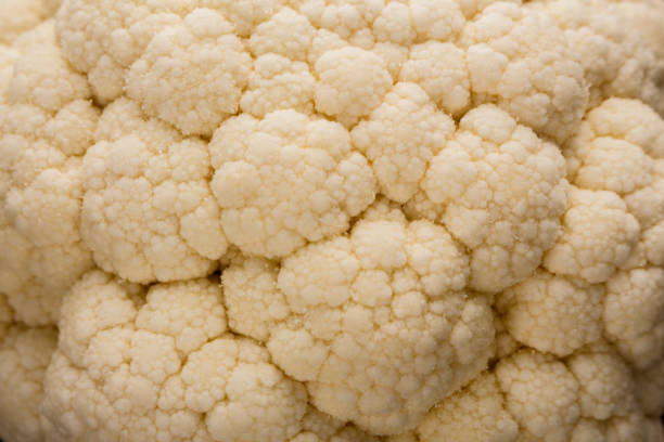 istock fresh cauliflower on a rustic wooden background 936524508