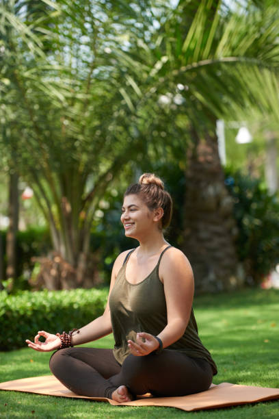 istock Obese Woman Practicing Yoga 936532554