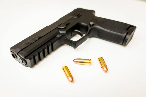 istock Handgun with ammo rounds and smoke 936533486