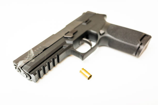 istock Handgun with ammo rounds and smoke 936533532