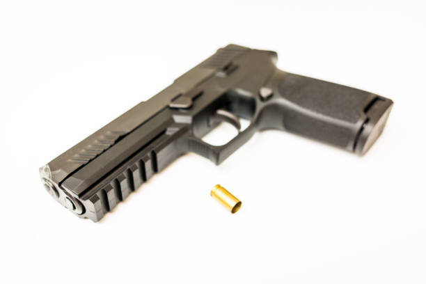 istock Handgun with ammo rounds and smoke 936533574