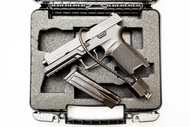 Locked disarmed handgun in case white background