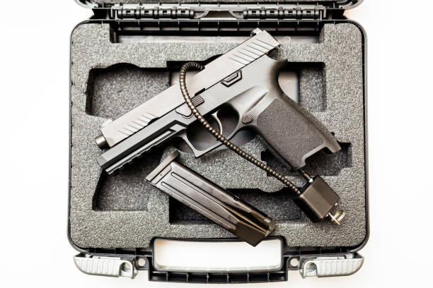 Locked disarmed handgun in case white background stock photo