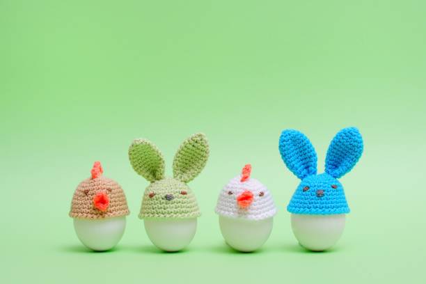 istock Easter holiday concept with cute handmade eggs, bunny, chicks on green background. Easter ideas 936543550