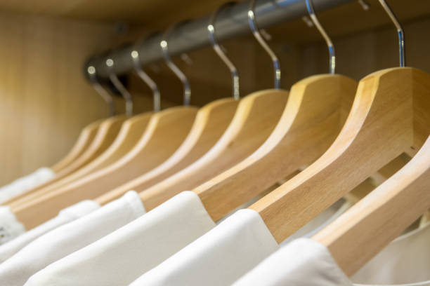 istock Hangers in a row with white shirts 936547844