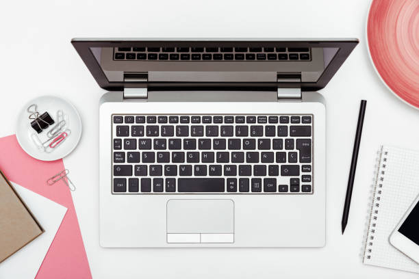 istock Feminine business desk from above on white background 936551408