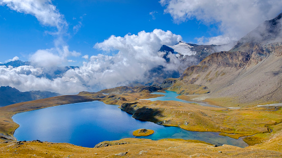 Mountain lakes on the footpath starting from the Nivolet Pass (Italian: Colle del Nivolet), a mountain pass located in the Gran Paradiso National Park. Valle d’Aosta, Italy (6 shots stitched)