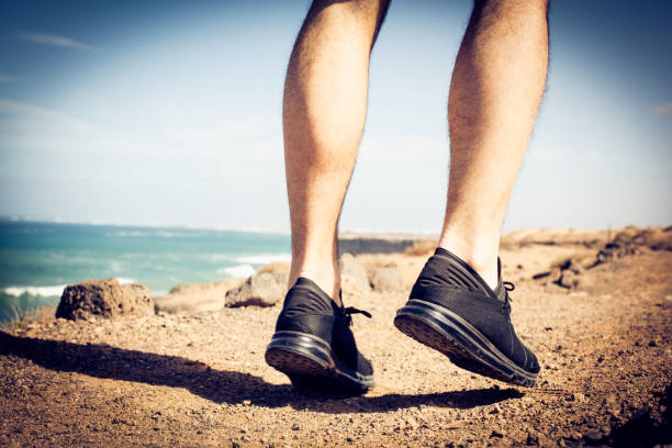 istock Man running. Close up image of his legs. 936560314