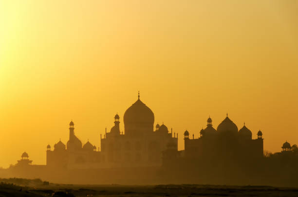 Sunrise over Taj Mahal View of Taj mahal in Agra, Uttar Pradesh, India. It is one of the most visited landmark in India. persian empire stock pictures, royalty-free photos & images