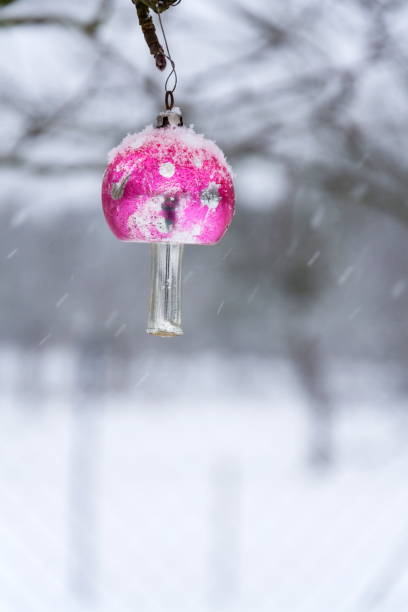 istock Fly agaric Christmas tree vintage glass decoration, falling snow landscape 936570356