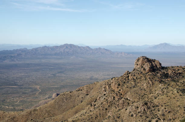 Quinlan Mountains and Sonoran Desert The Quinlan Mountains and Sonoran Desert as viewed from Kitt Peak National Observatory.  Kitt Peak is an astronomical observatory in the Sonoran Desert of Arizona on the Tohono O'odham Indian Reservation.  It has 23 obtical and 2 radio telescopes, making it the largest of observatory in the Northern Hemisphere. tohono o'odham stock pictures, royalty-free photos & images