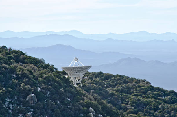 Radio Telescope at Kitt Peak National Observatory Kitt Peak is an astronomical observatory in the Sonoran Desert of Arizona on the Tohono O'odham Indian Reservation.  It has 23 obtical and 2 radio telescopes, making it the largest of observatory in the Northern Hemisphere. tohono o'odham stock pictures, royalty-free photos & images