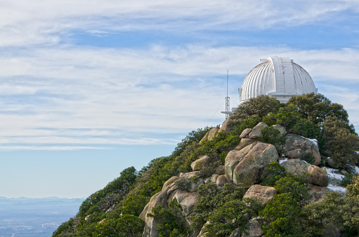 Kitt Peak is an astronomical observatory in the Sonoran Desert of Arizona on the Tohono O'odham Indian Reservation.  It has 23 obtical and 2 radio telescopes, making it the largest of observatory in the Northern Hemisphere.