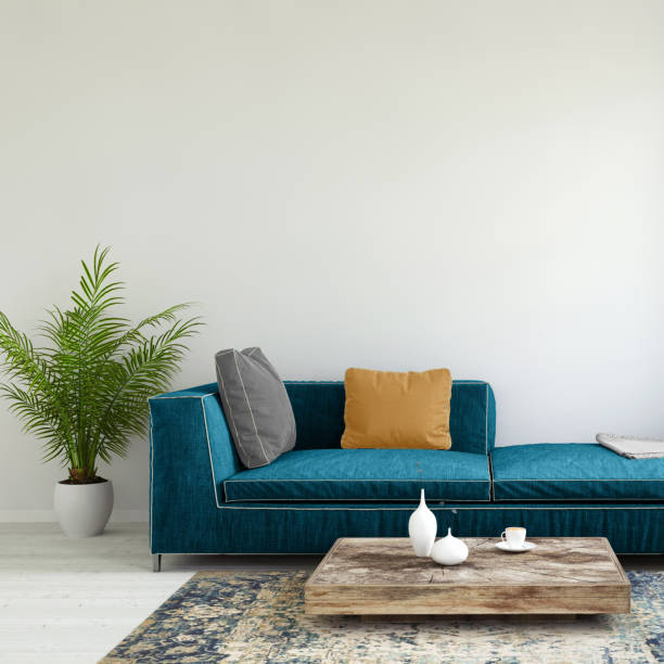 istock Pastel colored sofa with a plant and blank wall template 936572830