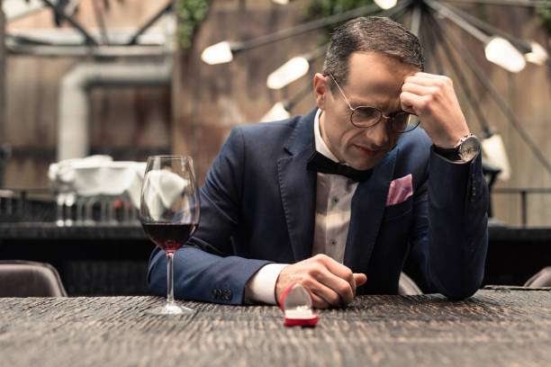 istock depressed man in suit with proposal ring crying after he get refused 936580684