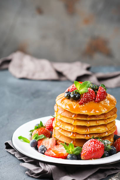 istock Stack of homemade pancakes for breakfast with berries 936584624