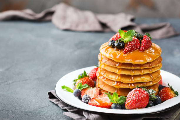 istock Stack of homemade pancakes for breakfast with berries 936584684