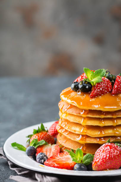 istock Stack of homemade pancakes for breakfast with berries 936586926