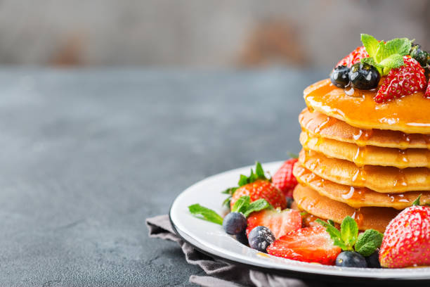 istock Stack of homemade pancakes for breakfast with berries 936586974