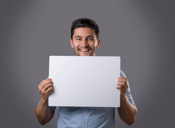 istock Businessperson with white empty cardboard 936587646