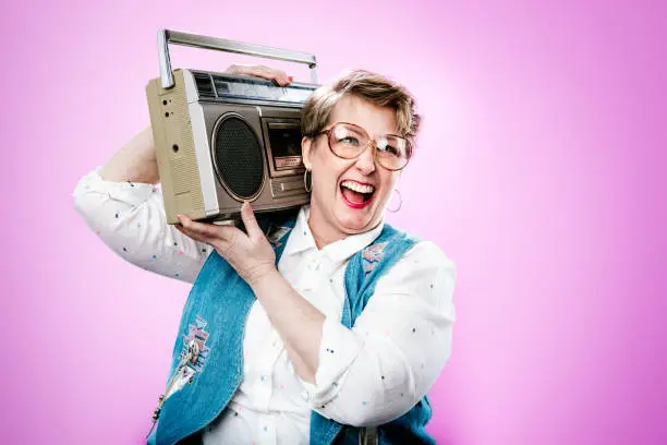Photo of Nineties Styled Woman Portrait With Boombox Stereo