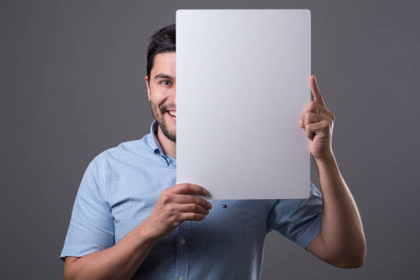 istock Businessperson with white empty cardboard 936588076