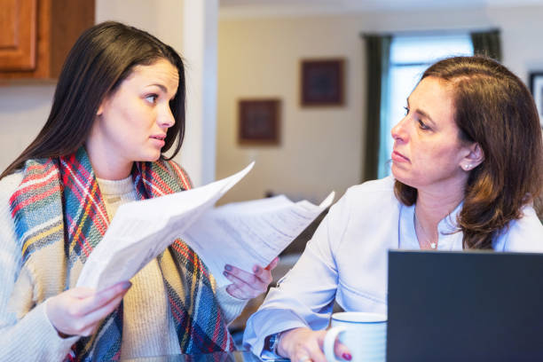 Mother and daughter arguing over utility bills