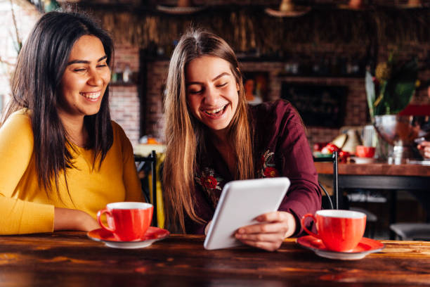 istock Females Surfing the net in restaurant 936591206