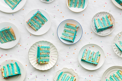 Slices of birthday layer cake overhead view