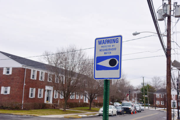 Protected By Neighborhood Watch Sign Blue and white neighborhood watch sign neighborhood crime watch stock pictures, royalty-free photos & images