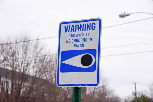 Close Up of a Neighborhood Watch Sign Blue and white neighborhood watch sign neighborhood crime watch stock pictures, royalty-free photos & images