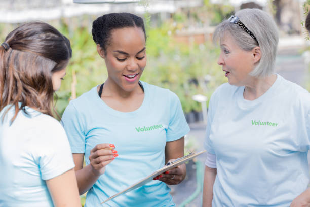 istock Three female nursery volunteers in discussion 936598928
