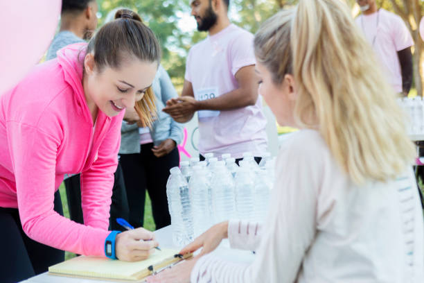 istock Woman registers for charity run 936599188