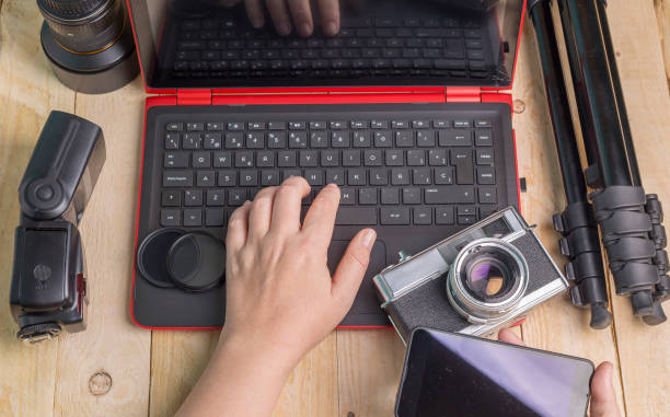 istock desktop with photography equipment 936602548