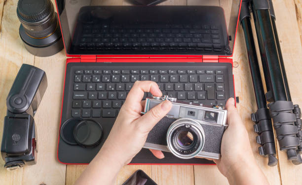 istock desktop with photography equipment 936602550