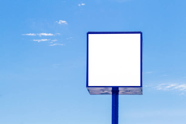 istock Mock up of advertising billboard with blue sky background 936602568
