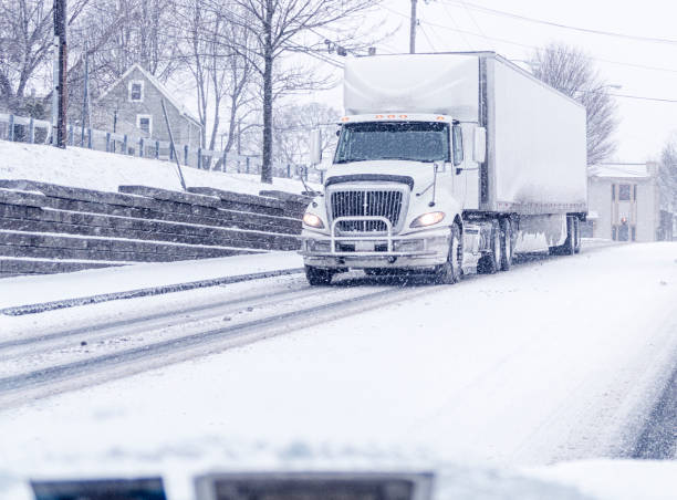 istock Winter Snow Storm Semi Tractor Trailer Truck 936603082