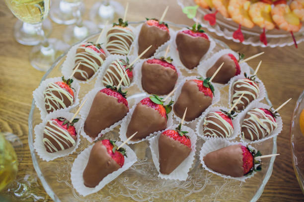istock Chocolate dipped strawberries at dessert bar. 936603186