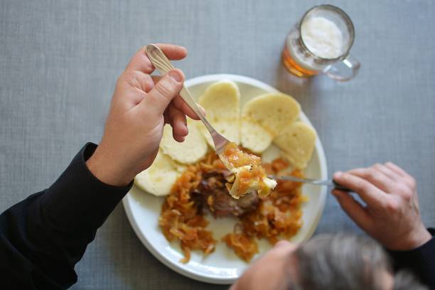 Sunday lunch in the kitchen - roasted meat with dumplings and cabbage