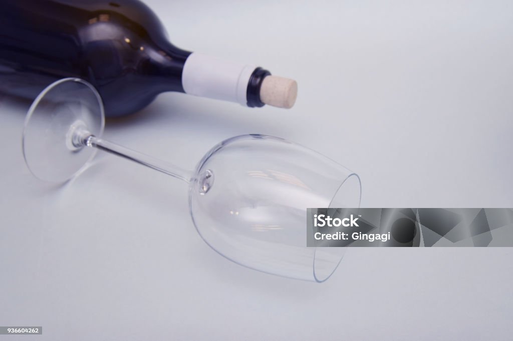 Glass Of Empty Glass And A Bottle Of Wine Alcoholism And Alcohol Damage  Neutral Background Copy Space Stock Photo - Download Image Now - iStock