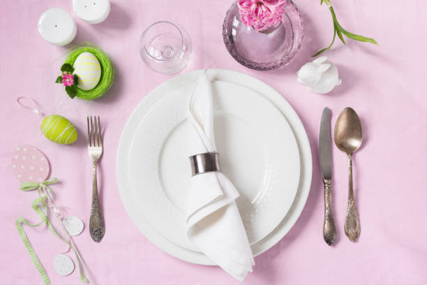istock Elegance table setting spring pink flowers on with pink linen tablecloth. Easter romantic dinner. Top view. 936606860